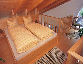 Schlafzimmer mit Blick auf den Reschensee - Mansarde